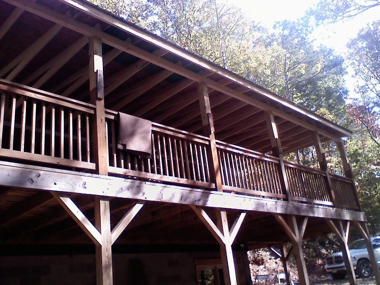 Timber framing under a new elevated porch and deck — Roof Leak Repair in Jaffrey by Roofing Brothers